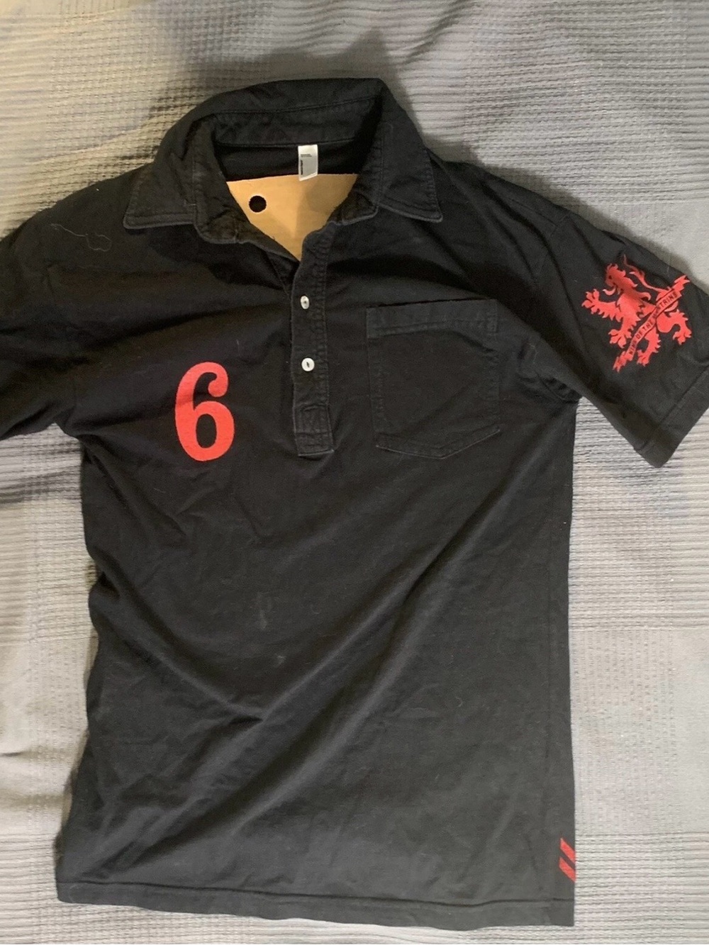 Men's Black Polo with Red Athletic Number and Sleeve Crest